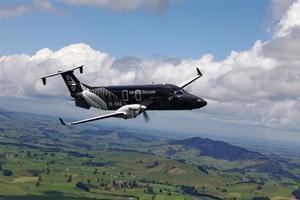 Air NZ Beech 1900 black - in air.
